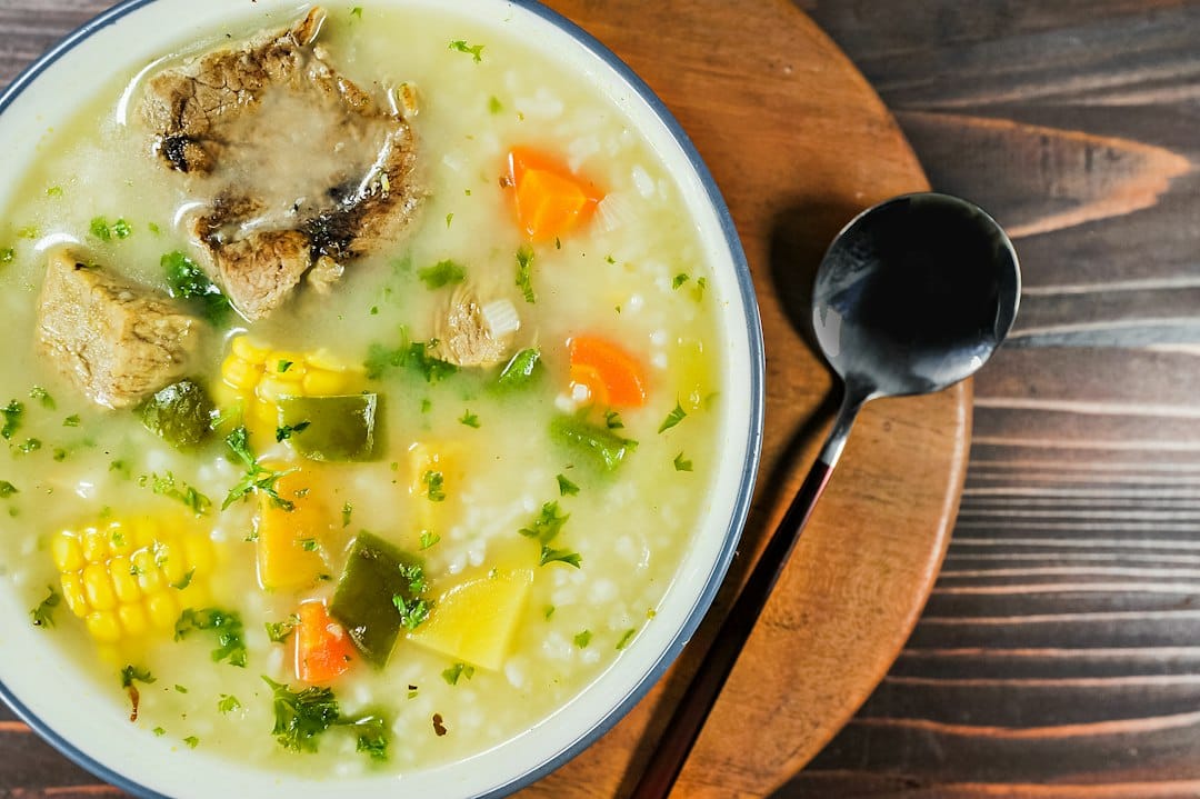 Kid-Friendly Crock Pot Meals: 10 Easy Slow Cooker Dinners 4 Warm slow-cooker chicken and vegetable soup served in a family bowl
