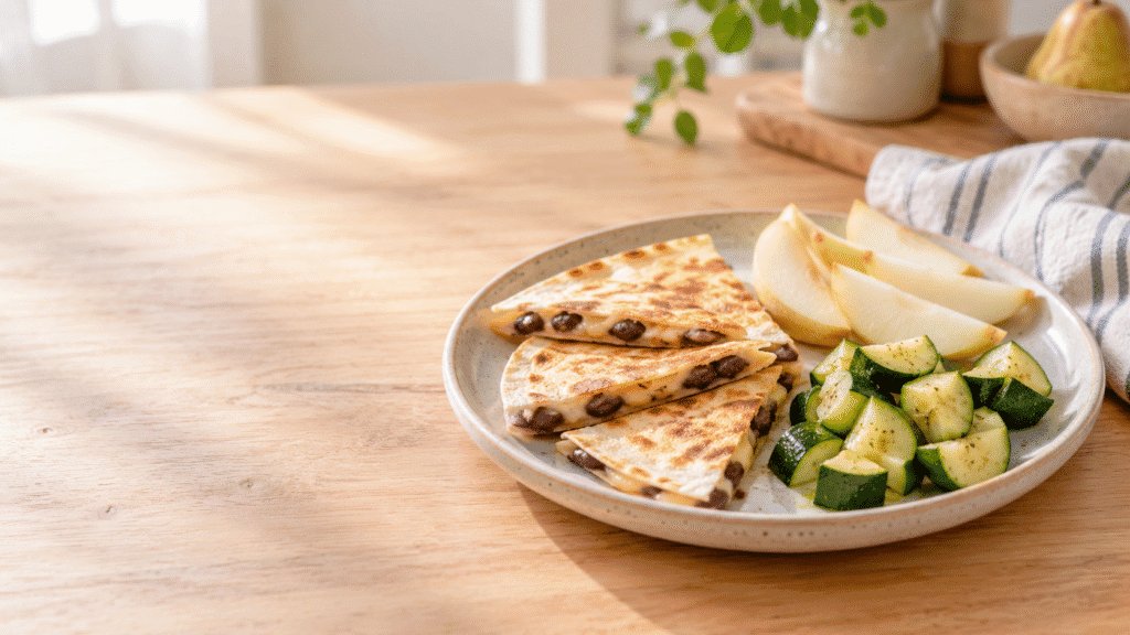 Home - Easy Recipes 10 Toddler lunch plate with a bean and cheese quesadilla, tender zucchini and pear slices